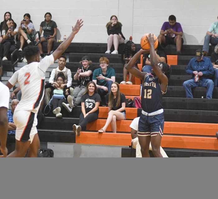 Wekiva's Abiah Charles shoots for a first-half 3-pointer against Leesburg's Camerin James. Charles scored a game-high 15 points, including the go-ahead 3-pointer, in the Mustangs' 45-42 victory. James had 13 points.
